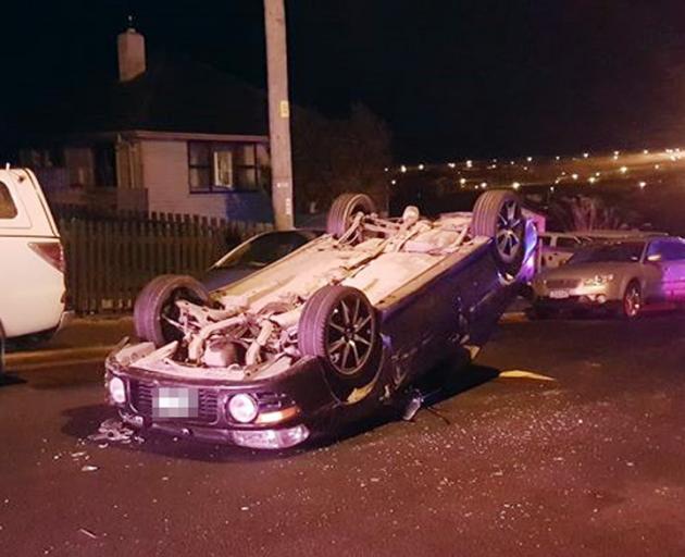 A car rolled after hitting two parked cars in Calton Hill yesterday. Photo: Kris Campbell