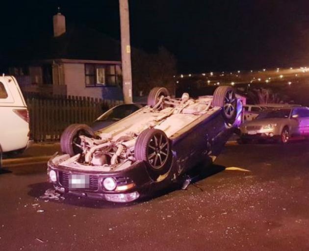A car rolled after hitting two parked cars in Calton Hill yesterday. Photo: Kris Campbell 