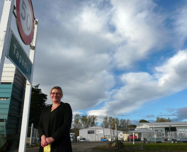 South West Autos Tapanui owner Racheal Hines wants the NZTA to move 50kmh signs further out of town to improve safety near her business. Photo: Richard Davison