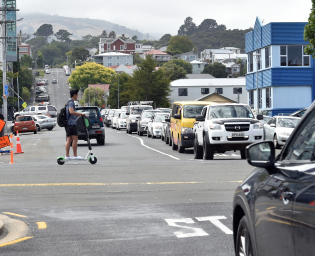 Traffic queues at the intersection of Clyde and Albany Sts yesterday, where a trial roundabout is...