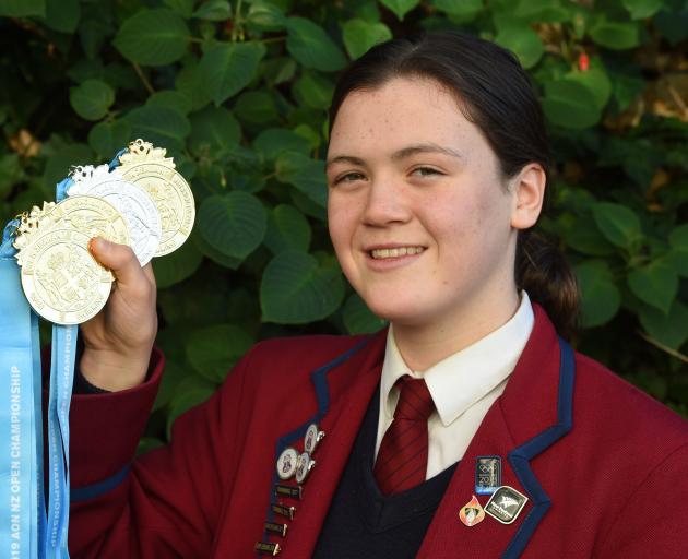 Kavanagh College pupil Erika Fairweather (15) with her medals from the national open swimming...