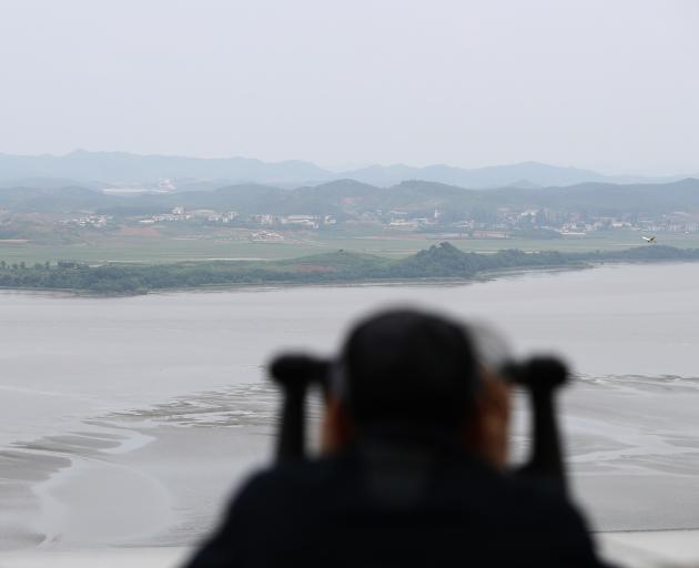 A visitor looks look over toward North Korea at the Unification observation post, near the...