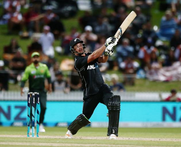 New Zealand's Colin de Grandhomme hits a six on his way to 74 not out against Pakistan at Seddon...