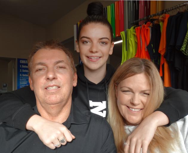Holly Wigg with her two biggest fans, parents David and Caroline. Photo: Mark Price