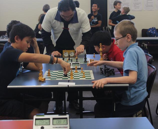 Ethan Tamariki (11, left) does battle with Tyrone McLeod (9) during the New Zealand Chess...