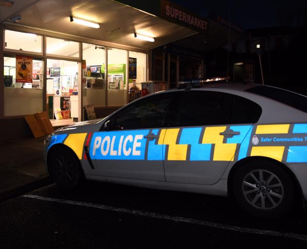 Police outside the Brockville Four Square Supermarket this morning. Photo: Stephen Jaquiery