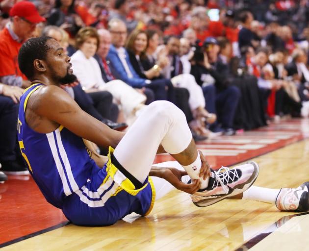 Kevin Durant on the ground after a suspected ruptured Achilles in game five of the NBA Finals in...