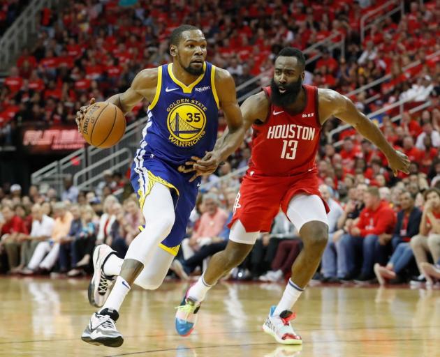 Kevin Durant takes the ball to the hoop against James Harden earlier in the playoffs. Photo:...