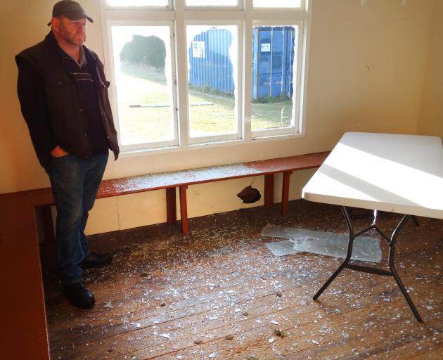 Waitaki Boys’ High School property manager Neil Conway inspects damage to the school’s cricket pavilion, which was vandalised on Monday night or  early yesterday. Photo: Daniel Birchfield