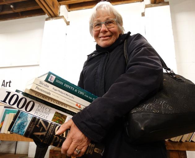 Wendy Smith, of Oamaru, holds her haul of finds at the Rotary Club of Oamaru Bookarama yesterday. 
