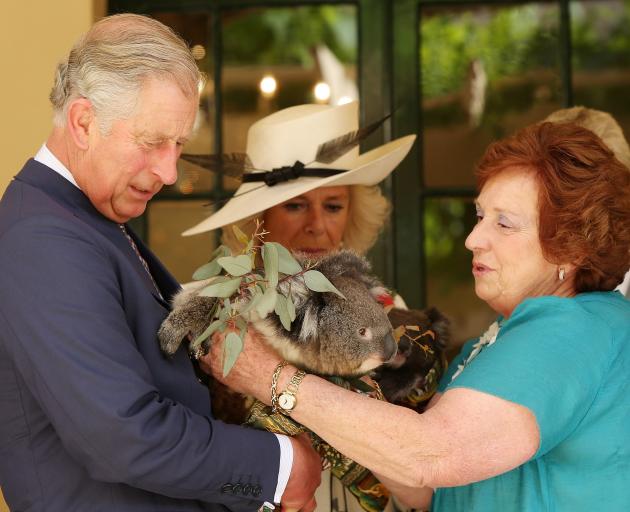 Camilla, Duchess of Cornwall, and Prince Charles, Prince of Wales, hold koalas with Koala rescue...