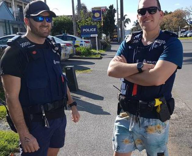 Acting sergeant Rob Eke and Constable Tal Easton still in their togs after nabbing a wanted man...