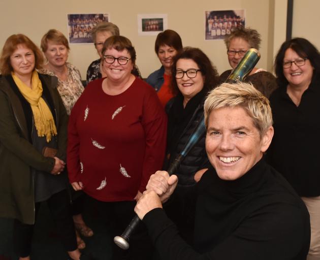 Brigid Inder, of Queenstown, with her old softball team during their reunion at the Rope and...