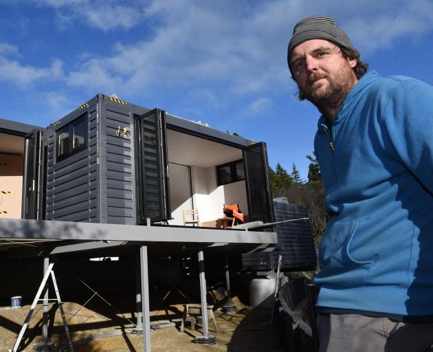 Toby Mann at his new Dunedin modular house, delivered 25 hours before this image was taken. Photo: Gregor Richardson
