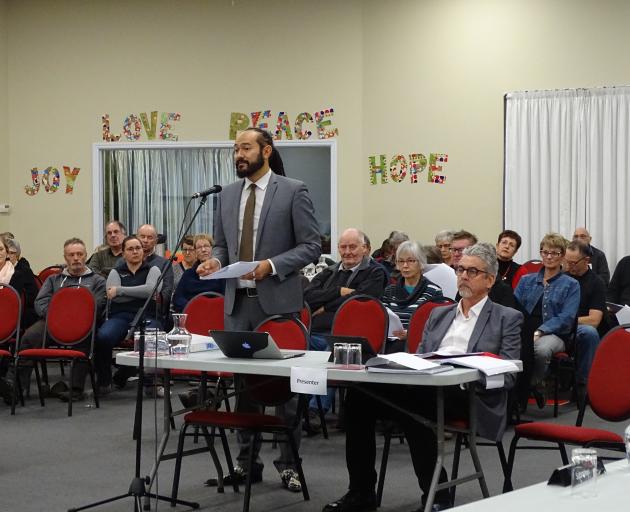 Barrister James Gardner-Hopkins (standing) presents evidence on behalf of residents opposed to ...