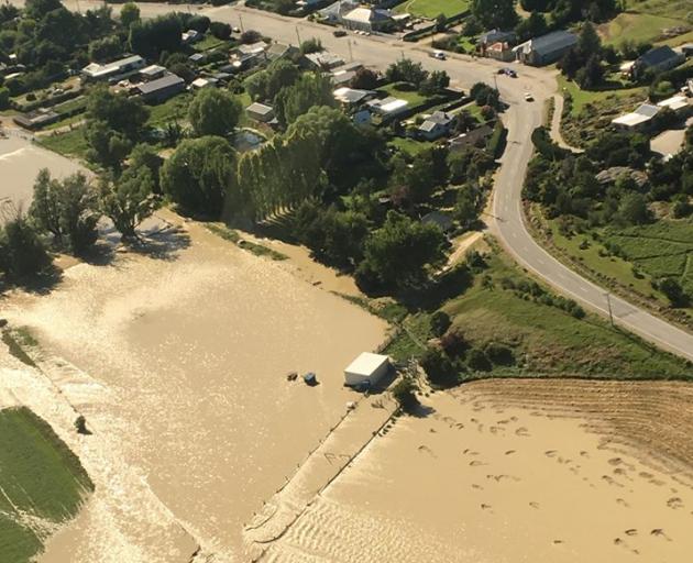 The Manuherikia River floods the outskirts of the Ophir township. Photo: Central Otago District...