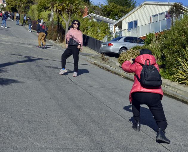 Tourists scale Baldwin St in North Dunedin yesterday. Photo: Gerard O'Brien