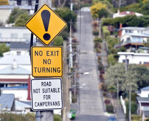 A Christchurch tour operator plans to continue taking a 12-seater vehicle up Baldwin St, despite...