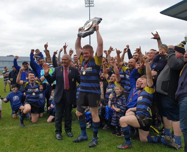 Invercargill Blues captain Michael Peterson lifts the Galbraith Shield after his side beat Star...