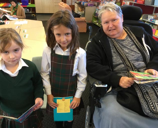 Teacher Jan Willison (right) visits St Gerard's School daily during term time to help children...