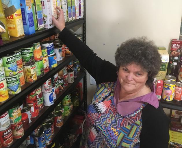 Central Otago Budgeting Services office manager/co-ordinator Pam Hughes handles donations of food at the Alexandra Community Pantry. Photo: Alexia Johnston