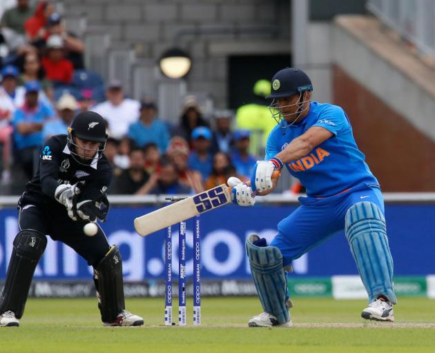  9th July 2019ICC World Cup cricket semi-final India batsman MS Dhoni forces his shot away outside his off stump Photo: Getty Images