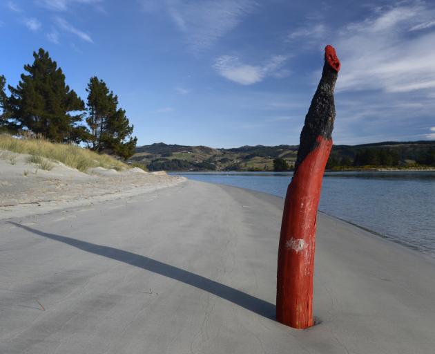 A pouwhenua appears at the Doctors Point inlet to Blueskin Bay. Photo: Gerard O'Brien