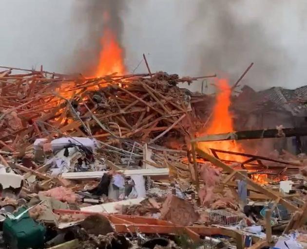 The burning remains of the Marble Court house. PHOTO: JAMES LOOYER