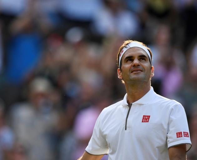 Switzerland's Roger Federer celebrates after winning his quarter final match against Japan's Kei Nishikori. Photo: Reuters