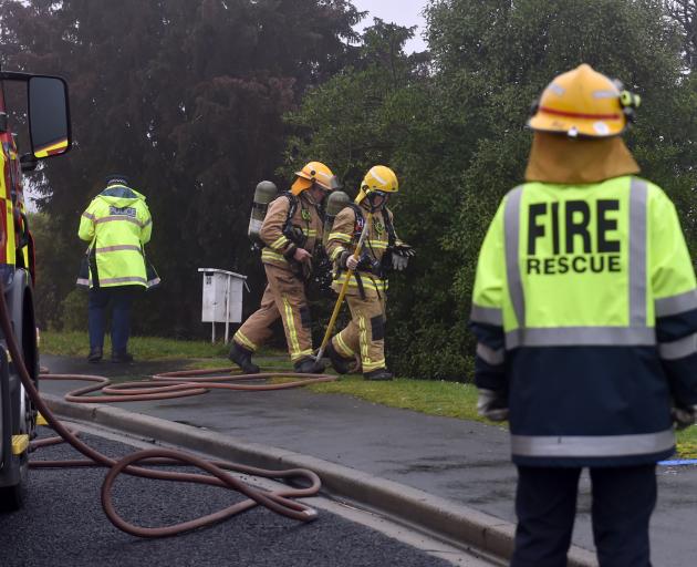 Firefighters attend the scene of a house fire on Panmure Ave in Calton Hill this afternoon. Photo...