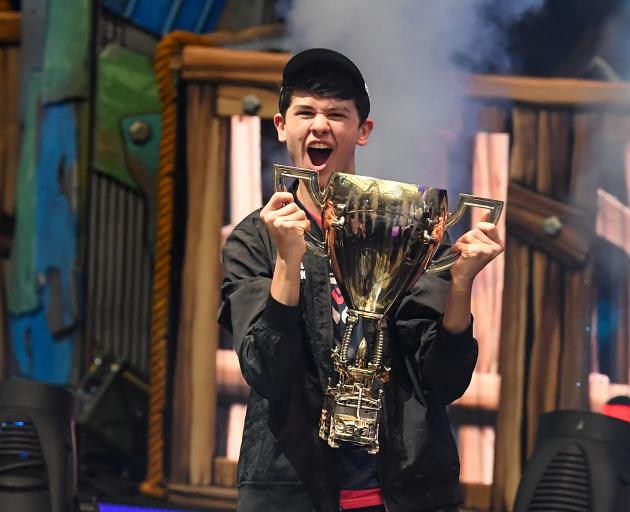 Kyle Giersdorf  celebrates his win as the first solo World Champion at the Fortnite World Cup Finals e-sports event. Photo: Dennis Schneidler-USA TODAY Sports via Reuters