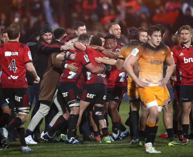 The Crusaders celebrate at the final whistle of their third-straight Super Rugby final victory....