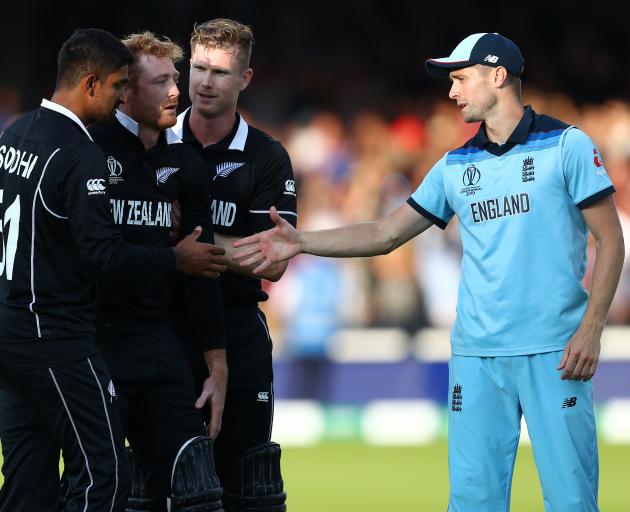 Chris Woakes of England offers his support to Martin Guptill. Photo: Getty Images