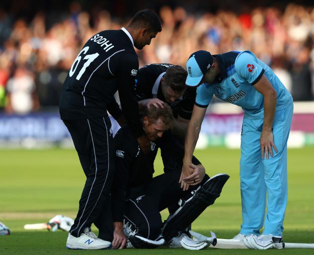 Black Caps Ish Sodhi and Jimmy Neesham are joined by England's Chris Woakes in consoling New...