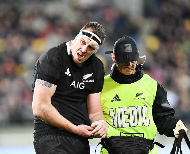 All Black lock Brodie Retallick leaves the field after his shoulder was damaged during a ruck in...