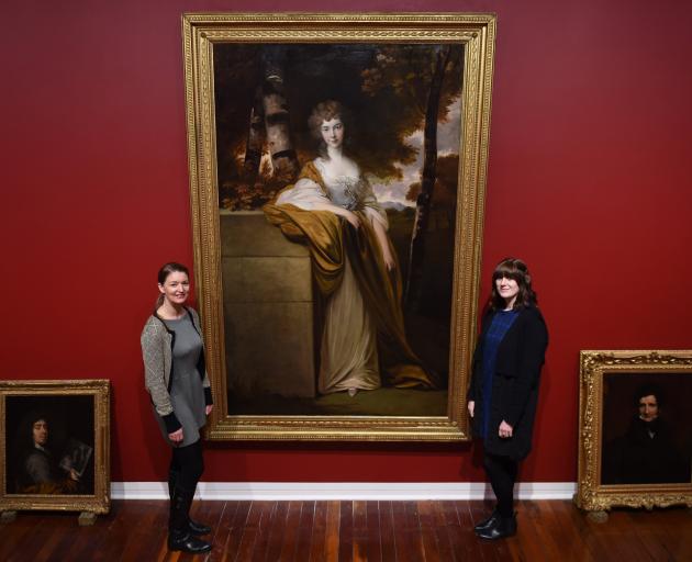 Dunedin Public Art Gallery curators Lucy Hammonds and Lauren Gutsell pictured with one of the large works being set up for ‘‘Style and Substance: A journey through the collection’’. Photo: Gregor Richardson