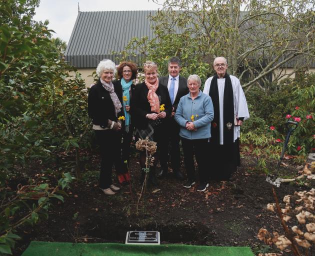 Laying flowers with the buried ashes at Whitestone Funerals' Westview Memorial Garden yesterday are (from left) Glenys Palmer (Lillingston Alice Rivers' niece), Whitestone Funerals manager Janeen Paull, funeral directors Rose Gard and Peter Hamilton, Jani