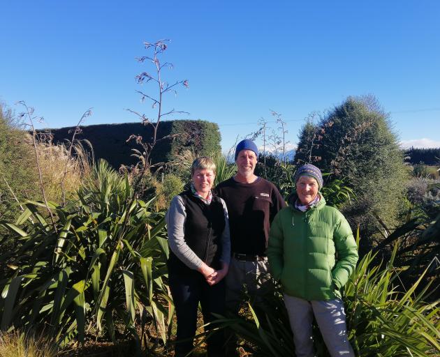 Julie (left), Phil and Helen Wells at their Wrights Rd planting project, which they started five years ago. Photo: Supplied