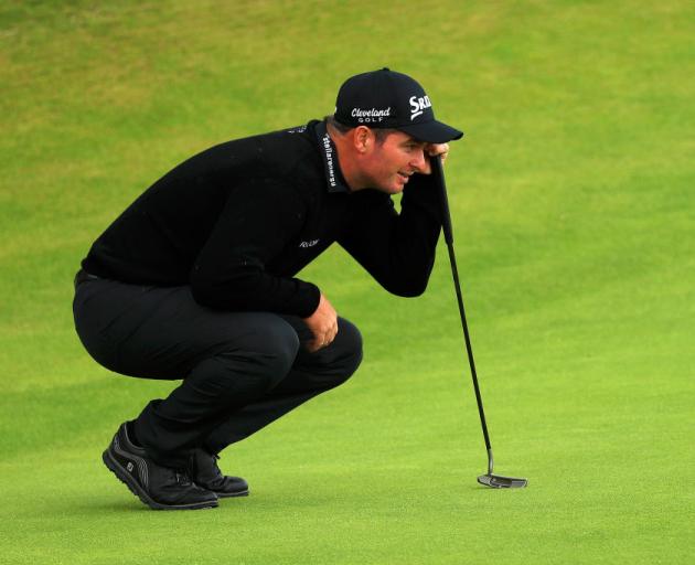 Ryan Fox of New Zealand lines up a putt on the 18th green during the first round of the 148th Open Championship. Photo: Getty Images