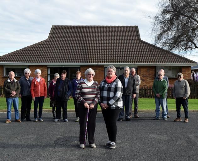 Pat Bowman (left) and Robyn Thomson, supported by their neighbours, take a stand on the recommended site for a new aquatic facility outside their units in Mosgiel. PHOTOS: SHAWN MCAVINUE Pat Bowman (left) and Robyn Thomson, supported by their neighbours, take a stand on the recommended site for a new aquatic facility outside their units in Mosgiel. PHOTOS: SHAWN MCAVINUE