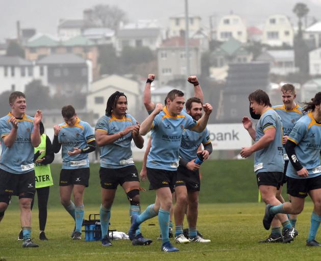 University players celebrate after winning their semifinal against Harbour at the University of...