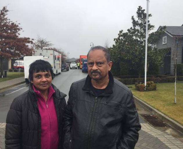 Akita and Indraj Fonsaka who live across the street from the Marble Court, Christchurch house...