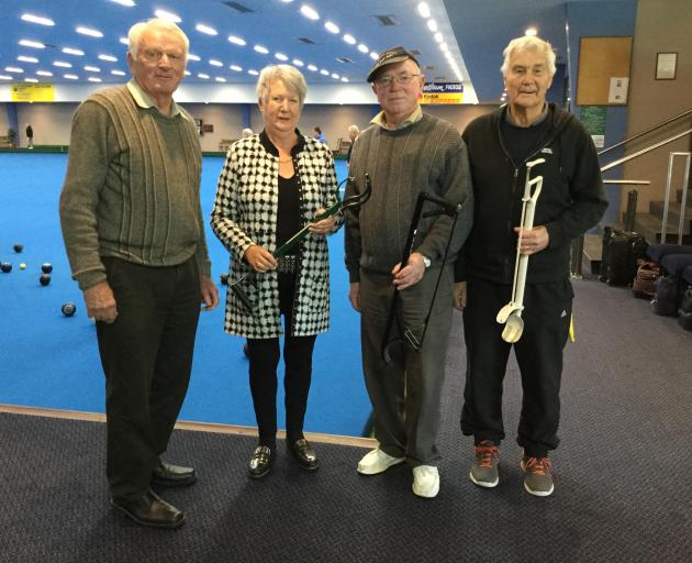 Rotary Club of Dunedin South president Jo Morshuis inspects bowling arms in Dunedin Lawn Bowls...
