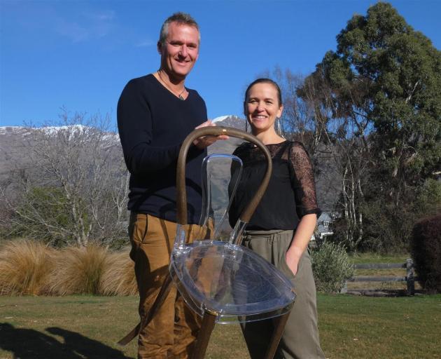 Wanaka couple Alex Guichard and Monique Kelly show the lightweight qualities of their chair made of natural materials. Photo: Simon Henderson