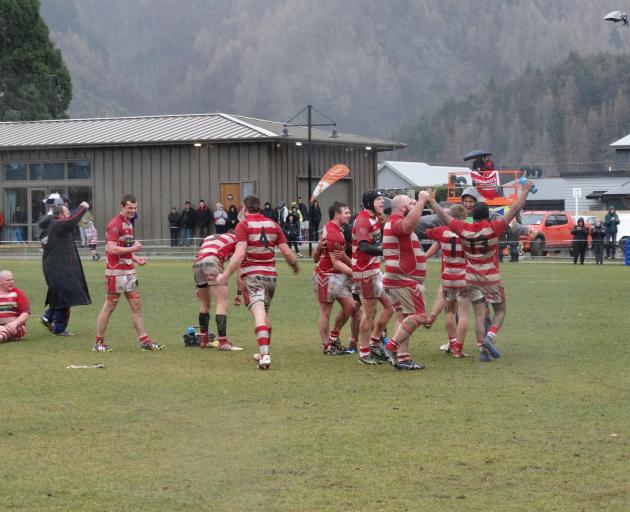 Clutha players celebrate their 24-14 victory over Arrowtown in the Countrywide final at Jack Reid...