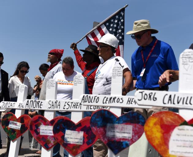 People pay their respects two days after a mass shooting in El Paso. Photo: Reuters