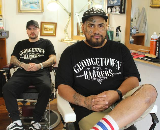 Fast-tracking success: Georgetown Barbers employee (left) Nate Walters with owner and friend Niko...