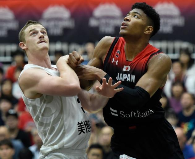 Finn Delany and Rui Hachimura battle for a rebound during the Tall Blacks' match against Japan...
