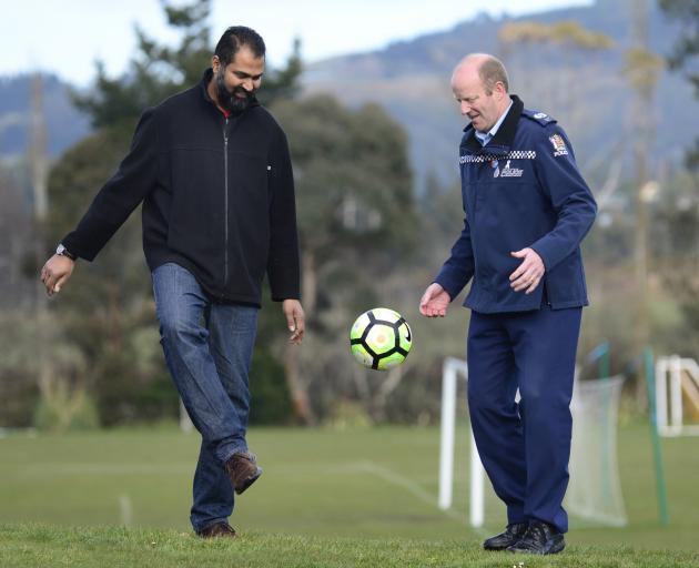 Otago Muslim Association president Dr Mohammed Rizwan (OMA United, left) kicks a ball around with...