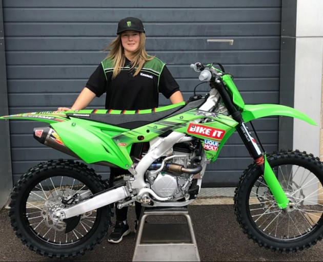 Dunedin motocross rider Courtney Duncan with the KX250 bike she will ride for her new team Bike It Dixon Racing Team in this year’s women’s world championship. Photo: Kawasaki Racing